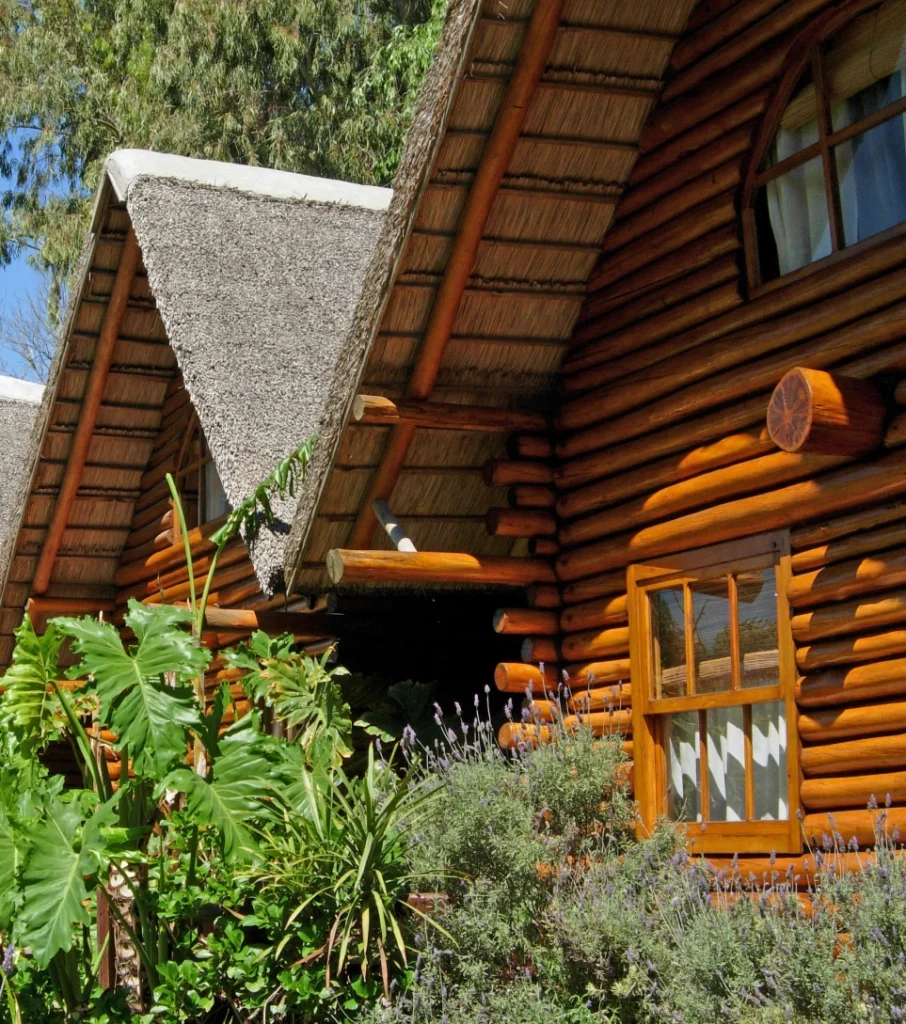 Rustic wood cabin lodge in a Patagonian garden