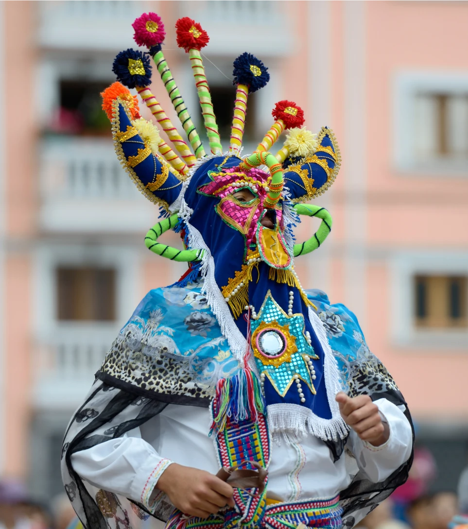 Traditional Ecuadorian festival masked dancer in colorful costume
