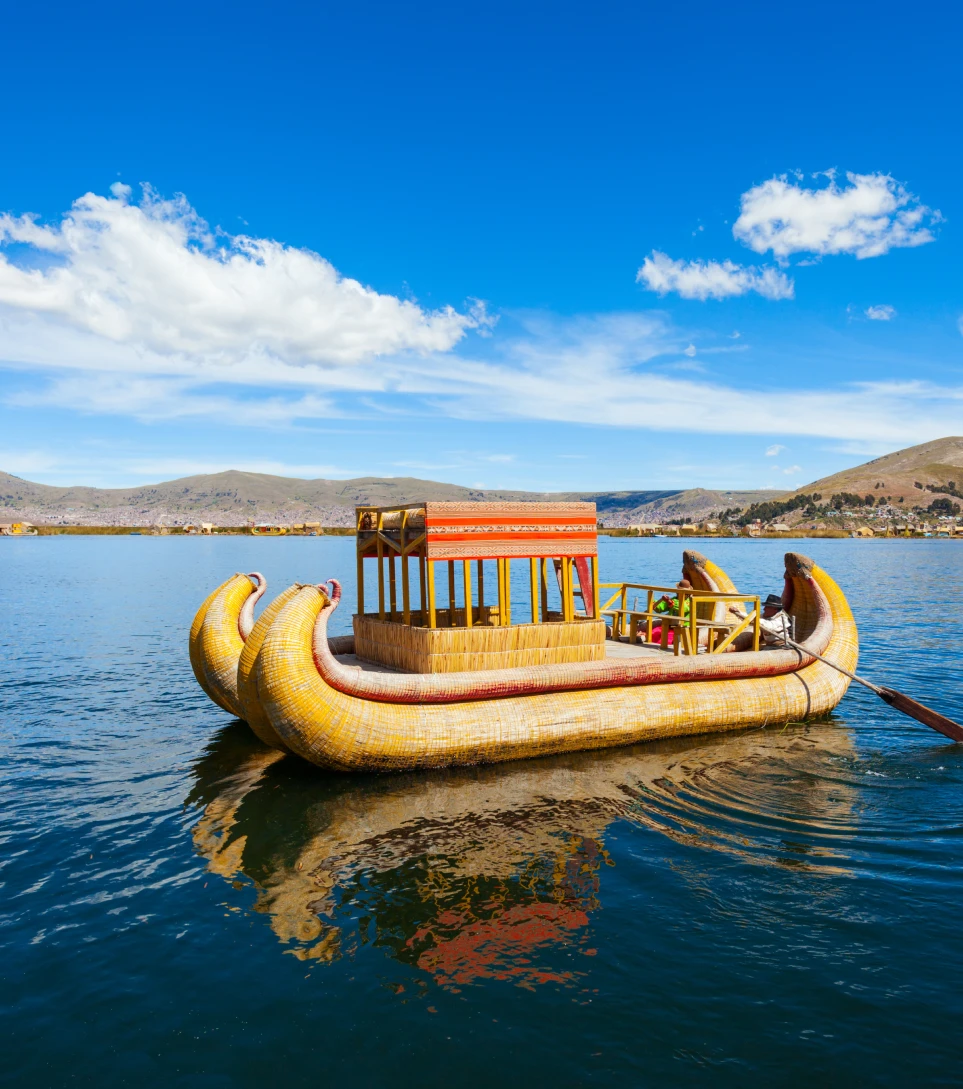 Totora reed boat on Lake Titicaca with travelers