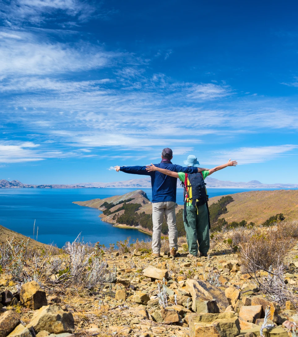 Couple celebrating atop Isla del Sol, Lake Titicaca